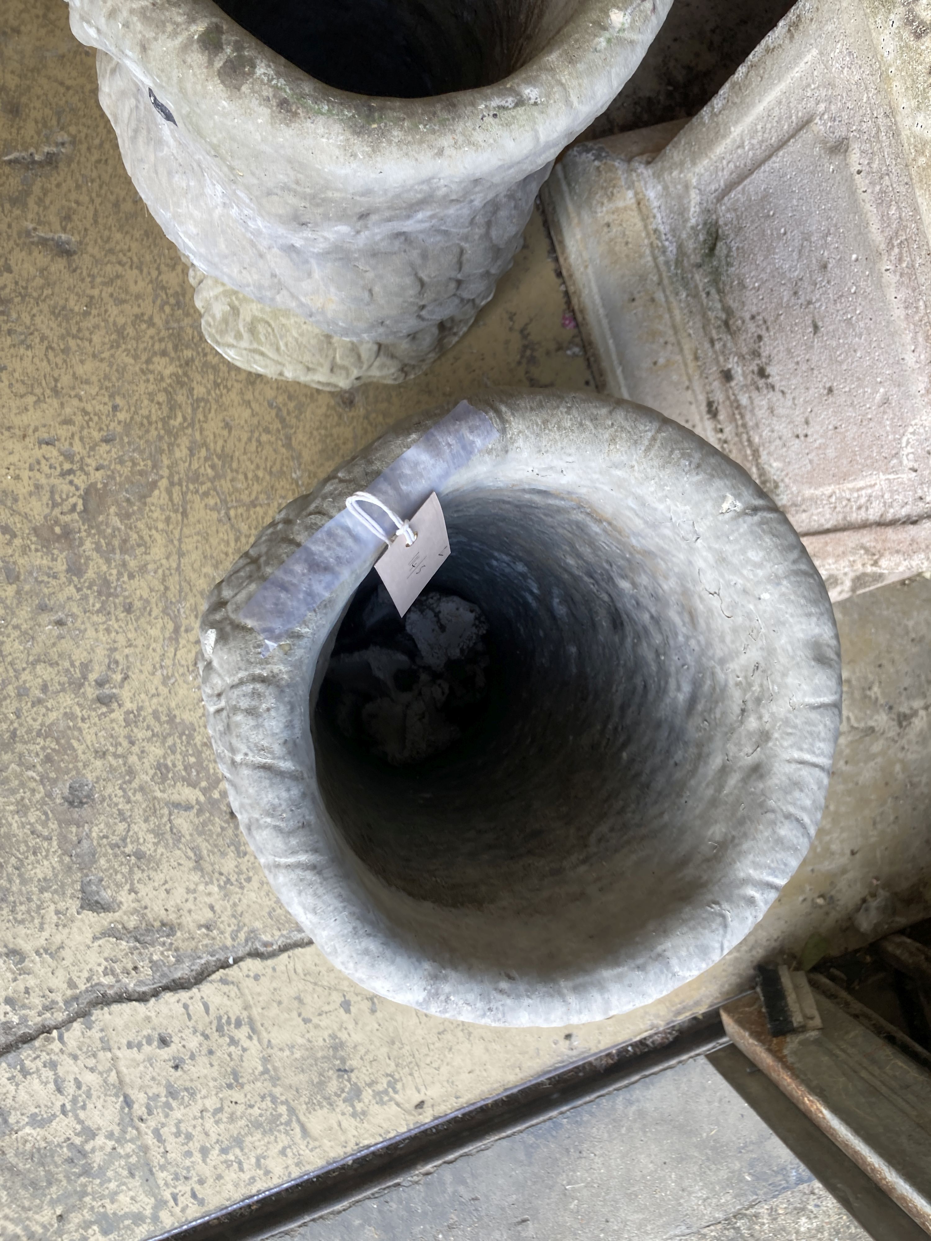 A pair of reconstituted stone owl garden planters, height 50cm